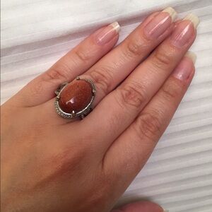 Red Goldstone on stainless steel ring